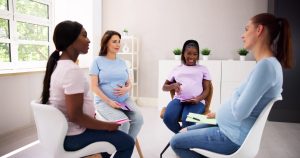 group of pregnant women supporting each other